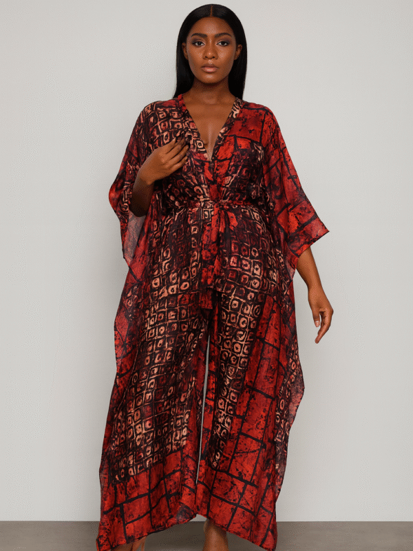 Red batik-style two-piece set with flowing kaftan top and wide-leg pants worn by a Black female model.