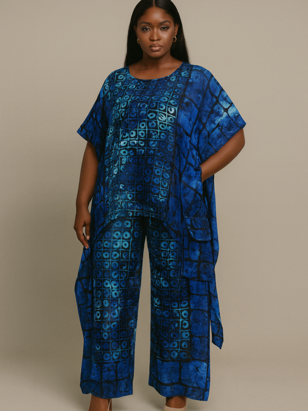 Blue patterned two-piece African print set with kaftan-style top and wide-leg pants worn by a Black female model